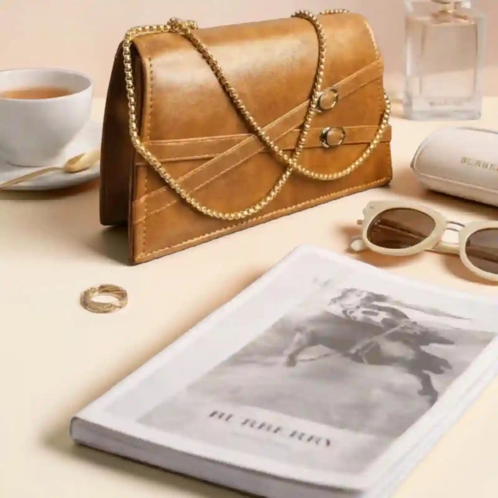 Elegant Brown Leather Clutch Bag with Gold Chain Strap
